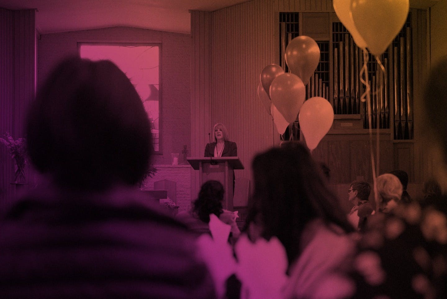 Speaker presenting from the pulpit.